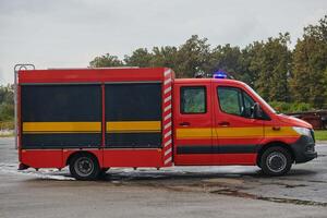 A state-of-the-art firetruck, equipped with advanced rescue technology, stands ready with its skilled firefighting team, prepared to intervene and respond rapidly to emergencies, ensuring the safety photo
