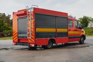 A state-of-the-art firetruck, equipped with advanced rescue technology, stands ready with its skilled firefighting team, prepared to intervene and respond rapidly to emergencies, ensuring the safety photo