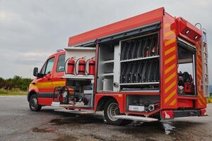 A state-of-the-art firetruck, equipped with advanced rescue technology, stands ready with its skilled firefighting team, prepared to intervene and respond rapidly to emergencies, ensuring the safety photo