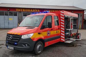 A state-of-the-art firetruck, equipped with advanced rescue technology, stands ready with its skilled firefighting team, prepared to intervene and respond rapidly to emergencies, ensuring the safety photo