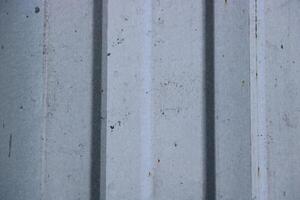 Metal sheet building material with vertical ridges photo