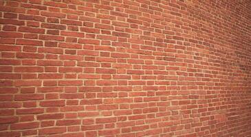The wall is made of dark red brick. The texture of the dark brown and red brick wall creates a panoramic background. photo