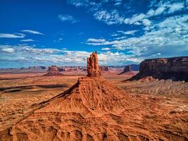 Massive Rock Formation Dominating Desert Landscape photo