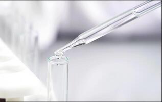 Scientist holding test tube in science lap photo