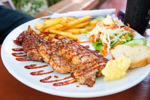 Grilled beef steak with salad on a plate photo