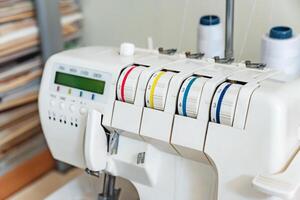 Front of a sewing machine loaded with threads photo