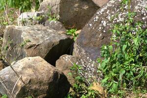 A rock formation on a nature, group of rock boulder photo