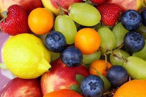 Beautiful Tropical Fruits Background A Luscious Display of Nature's Bounty, Featuring an Abundance of Colorful and Exotic Fruits Against a Vibrant and Refreshing Backdrop photo