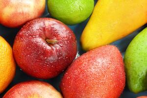 Beautiful Tropical Fruits Background A Luscious Display of Nature's Bounty, Featuring an Abundance of Colorful and Exotic Fruits Against a Vibrant and Refreshing Backdrop photo