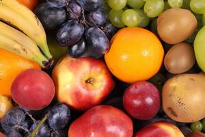 Beautiful Tropical Fruits Background A Luscious Display of Nature's Bounty, Featuring an Abundance of Colorful and Exotic Fruits Against a Vibrant and Refreshing Backdrop photo