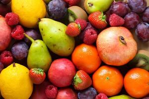 Beautiful Tropical Fruits Background A Luscious Display of Nature's Bounty, Featuring an Abundance of Colorful and Exotic Fruits Against a Vibrant and Refreshing Backdrop photo