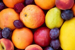 Beautiful Tropical Fruits Background A Luscious Display of Nature's Bounty, Featuring an Abundance of Colorful and Exotic Fruits Against a Vibrant and Refreshing Backdrop photo