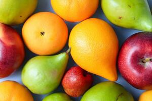 Beautiful Tropical Fruits Background A Luscious Display of Nature's Bounty, Featuring an Abundance of Colorful and Exotic Fruits Against a Vibrant and Refreshing Backdrop photo