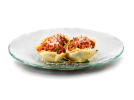 Vegetarian spinach and ricotta stuffed shells with tomato sauce served on a transparent glass dish png