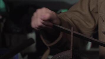 The iron part is processed by the file. Close-up 4K video