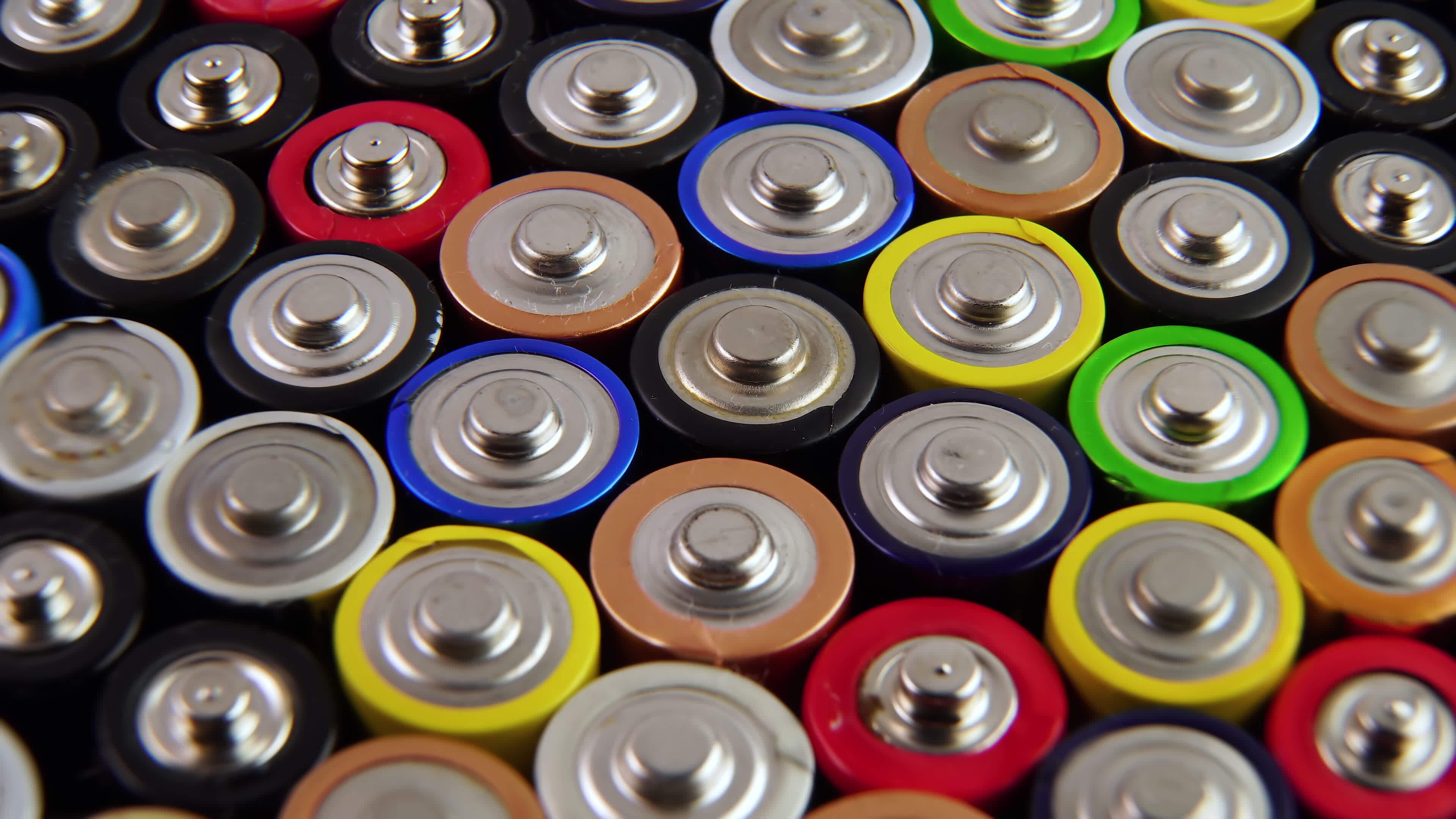 Closeup of used AA batteries. The finger batteries rotate. The harmful