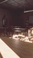 View to classroom with tables and small blackboard and grungy walls video