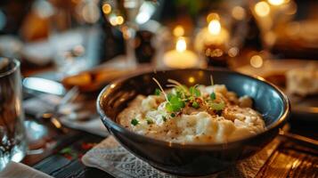 A bowl of delectable Greek Skordalia Garlic Dip waiting on a rustic table photo