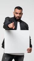 Bearded man pointing at a blank whiteboard with purpose photo