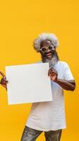 A bearded man with glasses holds a blank sign photo