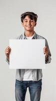 A young man confidently holds a white sign in his hands, ready to make a statement photo