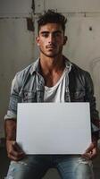 A man holds a blank sign in his hands, his expression conveying a sense of emptiness and longing photo