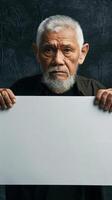 Elderly man holding a large white sign photo