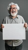 A Latin smile, mature man, model, holding a blank white board photo