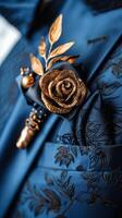 A close up of a tie featuring a beautiful rose boutonniere, adding a touch of sophistication photo