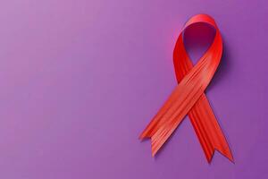 Red cancer ribbon on purple background. 3D illustration with blank space. photo