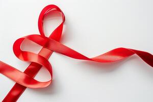 Red cancer ribbon isolated on white. Minimalist concept. Stock photo style.