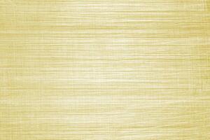 Golden texture of shiny scratched metal. Abstract gold background. photo