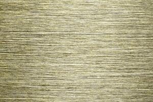 Golden texture of shiny scratched metal. Abstract gold background. photo