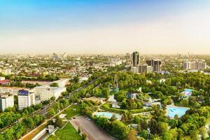 Uzbekistan, Tashkent - April 24, 2023 Top view from the observation deck on the Tashkent TV tower to the central part of the city during the daytime in spring. photo