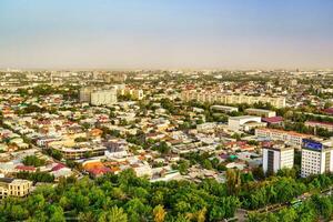 Uzbekistan, Tashkent - April 24, 2023 Top view from the observation deck on the Tashkent TV tower to the central part of the city during the daytime in spring. photo