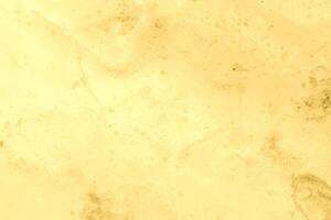 Texture of golden decorative plaster or concrete. Abstract gold grunge background. photo
