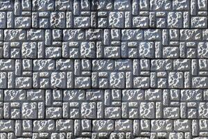 Texture of a decorative brick-like tiles. Abstract background for design. photo