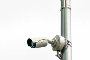 Security camera or CCTV on cloudy sky background. photo