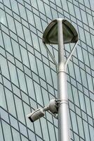 Security control camera or CCTV on a building background. photo