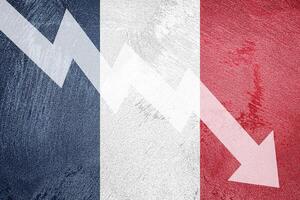 Arrow down on the background of the France flag. The concept of economic recession, depression and crisis. photo