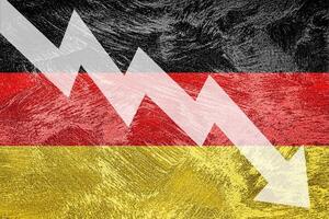 Arrow down on the background of the Germany flag. The concept of economic recession, depression and crisis. photo