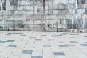 Texture of stone wall covered with tiles and pavement. photo