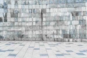 Texture of stone wall covered with tiles and pavement. photo