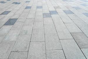 The texture of a tiled pavement with perspective. photo