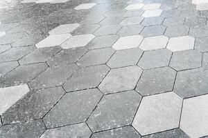 The texture of hexagonal tiled pavement with perspective. photo