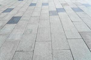 The texture of a tiled pavement with perspective. photo