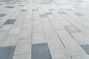 The texture of a tiled pavement with perspective. photo
