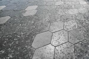 The texture of hexagonal tiled pavement with perspective. photo