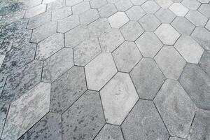 The texture of hexagonal tiled pavement with perspective. photo