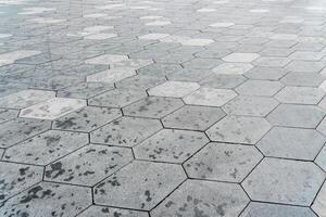 The texture of hexagonal tiled pavement with perspective. photo